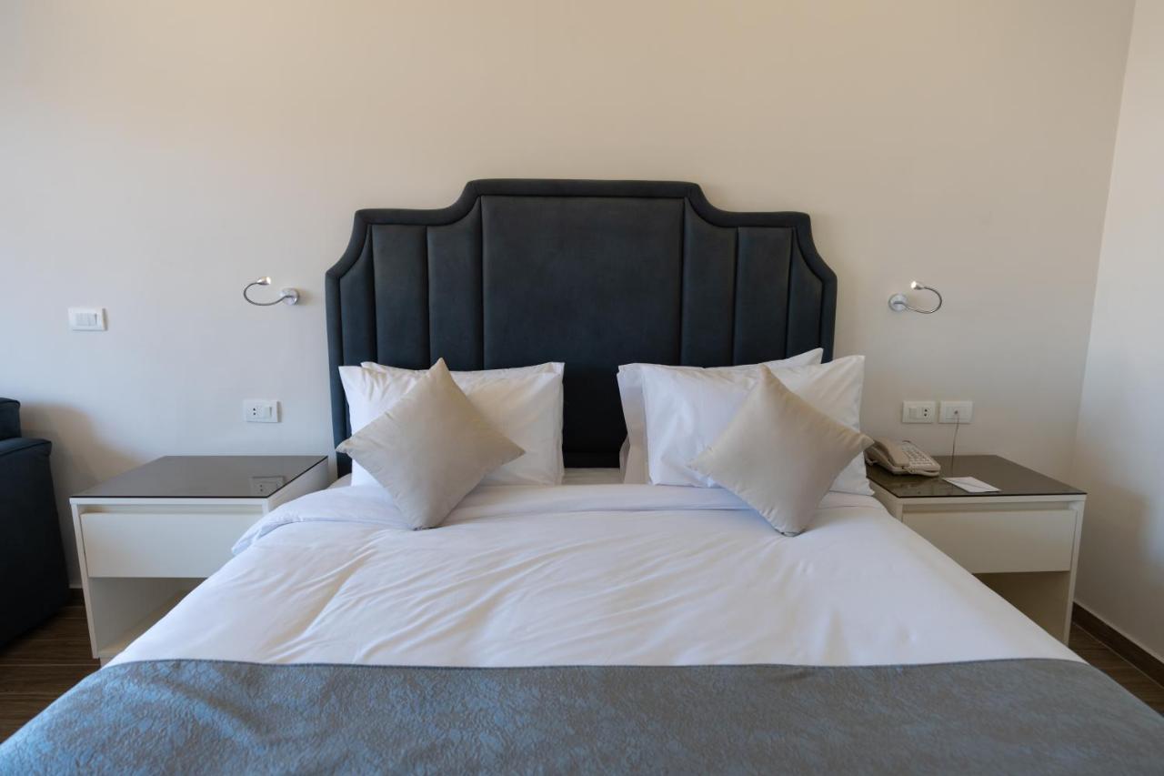 Parrotel Beach Resort Sharm el-Sheikh Exterior photo A bed with a headboard